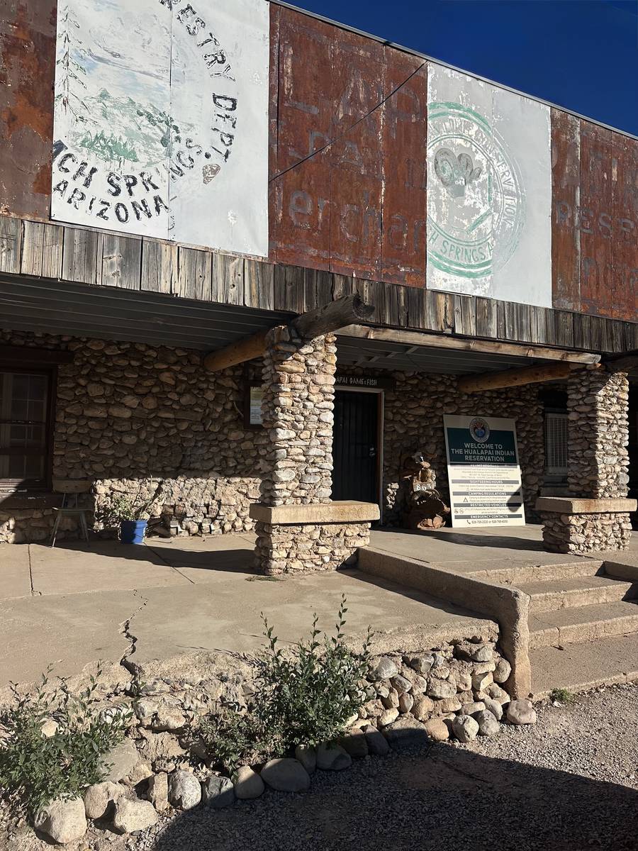 The historic Peach Springs Trading Post with stone pillars, now the Hualapai Game and Fish Department